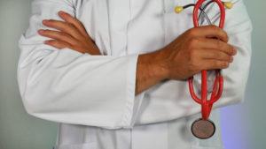 Physician holding stethoscope