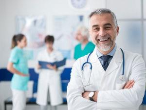 Physician standing in front of other physicians
